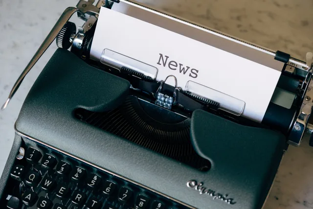 A vintage typewriter with a paper titled 'News', symbolizing journalism and communication. Press release distribution review methodology: how services are admitted and scored